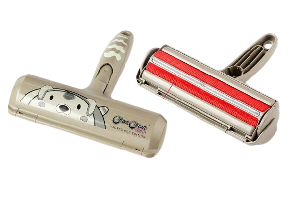 Orange ChomChom Roller featuring a cute cartoon cat face and striped handle